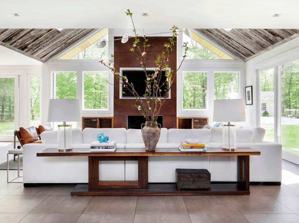 Example of a trendy open concept living room design in New York with white walls
