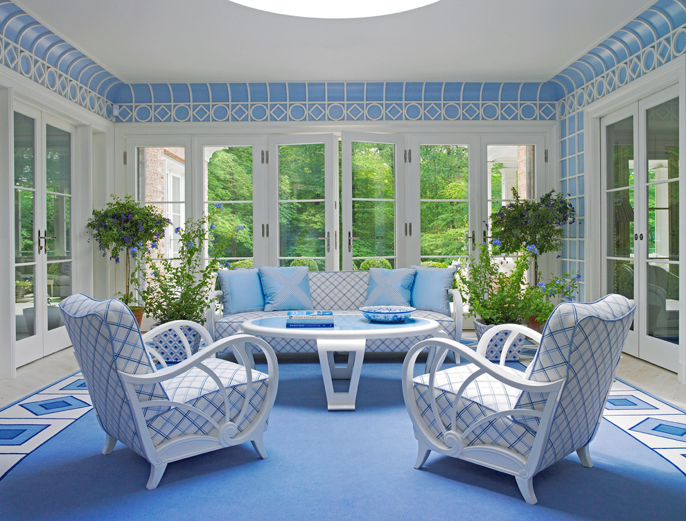 Elegant living room photo in New York with blue walls