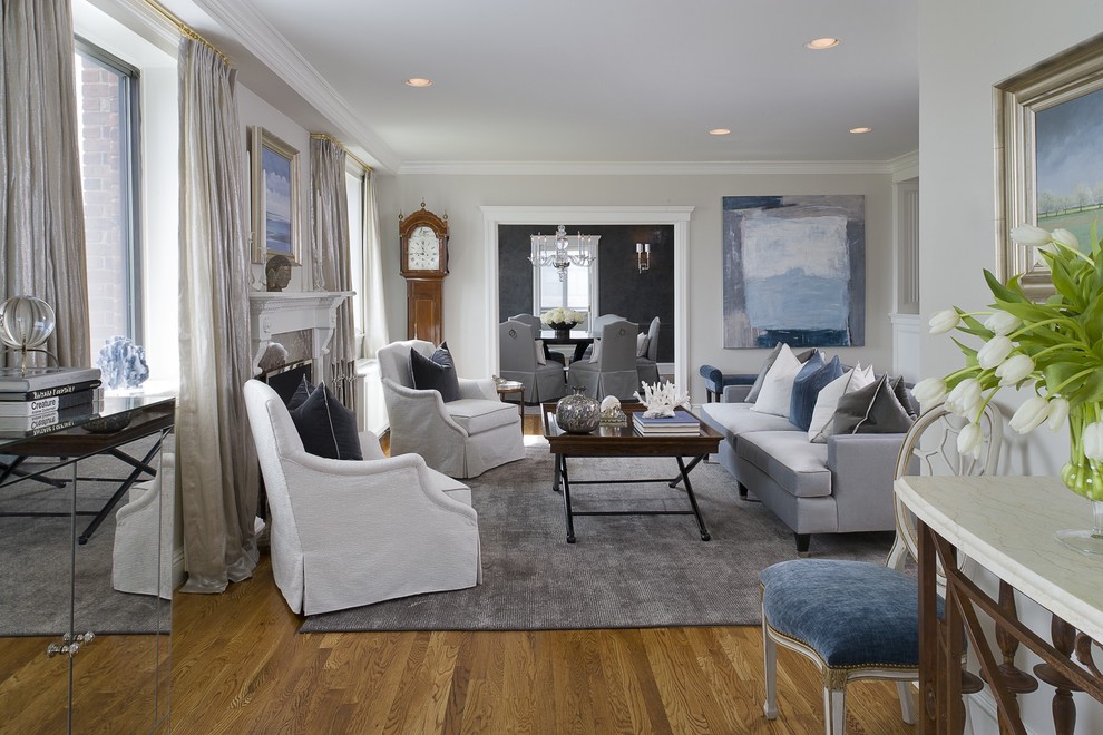 Living room - mid-sized transitional formal and enclosed medium tone wood floor living room idea in New York with gray walls, a standard fireplace, no tv and a stone fireplace