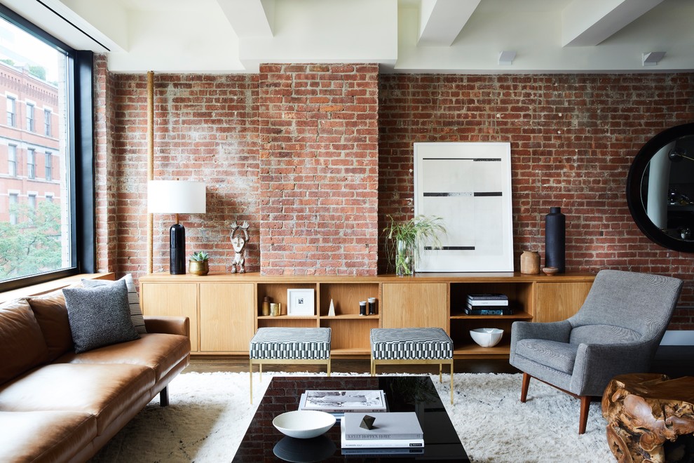 Living room library - scandinavian open concept dark wood floor living room library idea in New York with red walls and no fireplace