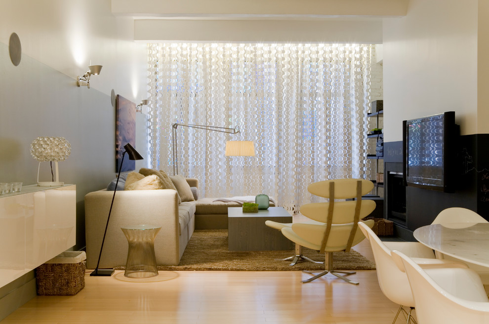 Small contemporary living room curtain in New York with a standard fireplace and a wall mounted tv.