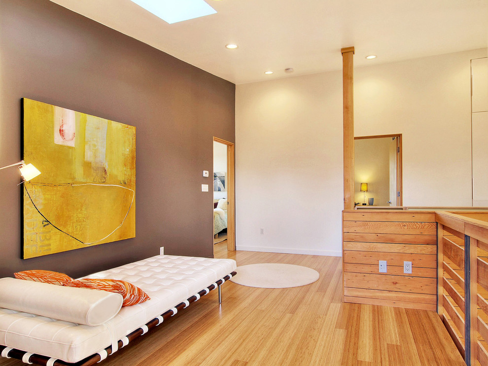 This is an example of a modern living room feature wall in Seattle with white walls.