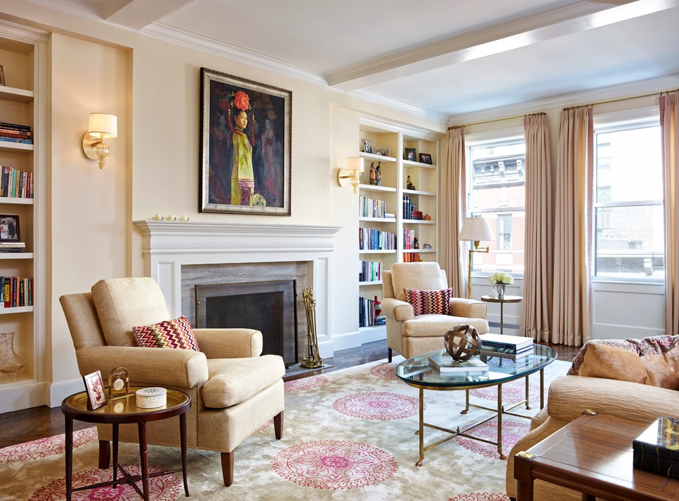 Large traditional formal open plan living room in New York with beige walls, dark hardwood flooring, a standard fireplace and a plastered fireplace surround.