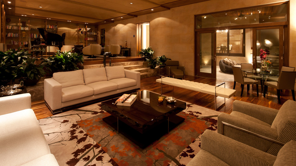 Living room - large modern formal and open concept dark wood floor living room idea in Houston with beige walls, no fireplace and no tv