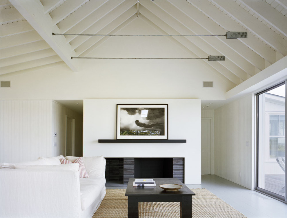 Inspiration for a coastal living room remodel in New York with white walls and no tv