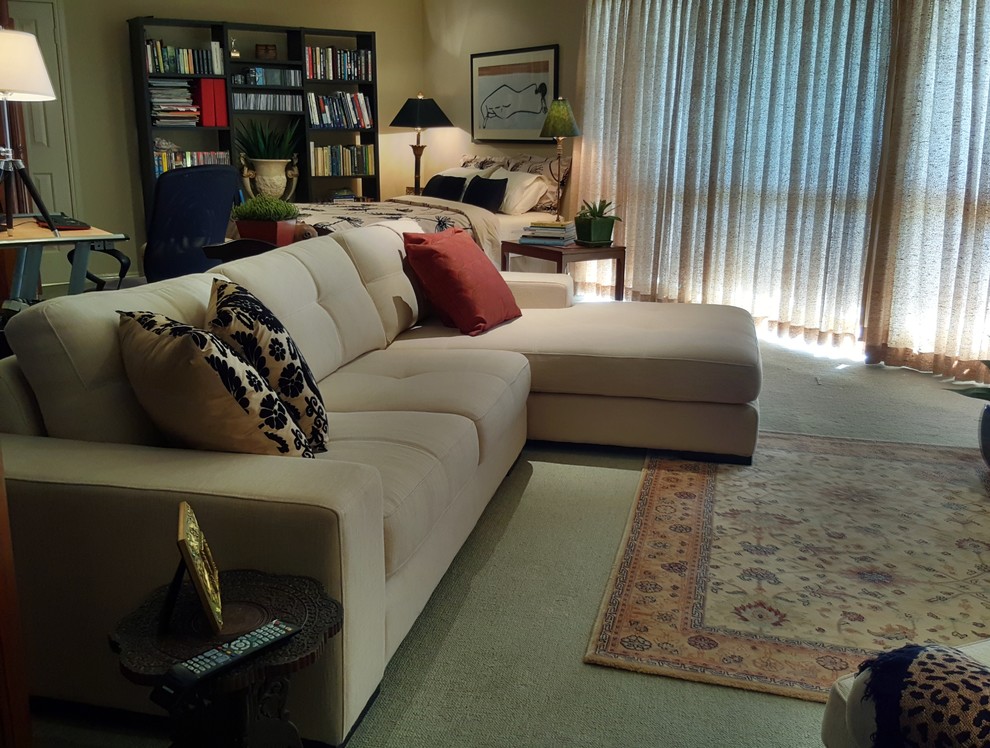 Inspiration for a mid-sized eclectic loft-style carpeted and green floor living room remodel in Brisbane with beige walls and no fireplace