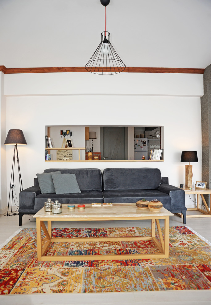 Inspiration for a scandinavian open concept gray floor living room remodel in Other with white walls