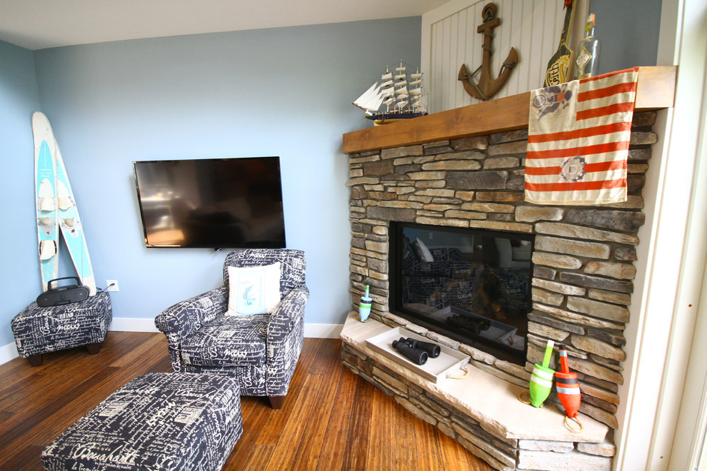 This is an example of a coastal living room in Minneapolis with a stone fireplace surround.
