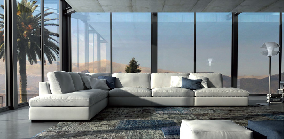 Imagen de salón para visitas cerrado contemporáneo grande sin chimenea y televisor con suelo de cemento y suelo gris