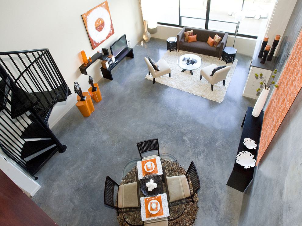 Medium sized industrial formal enclosed living room in Portland with concrete flooring, grey walls, a standard fireplace, a metal fireplace surround, no tv, grey floors and feature lighting.