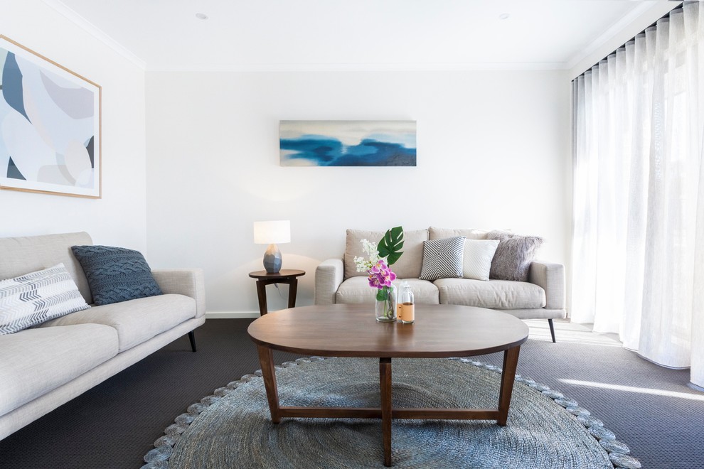 Repräsentatives, Abgetrenntes Modernes Wohnzimmer mit weißer Wandfarbe, Teppichboden und grauem Boden in Melbourne