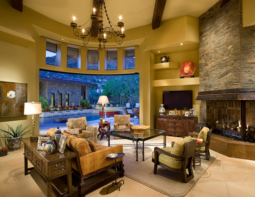 This is an example of an expansive eclectic formal enclosed living room in Phoenix with beige walls, carpet, a standard fireplace, a stone fireplace surround, a wall mounted tv and beige floors.