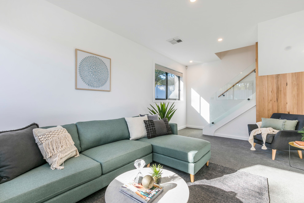 Example of a beach style living room design in Canberra - Queanbeyan