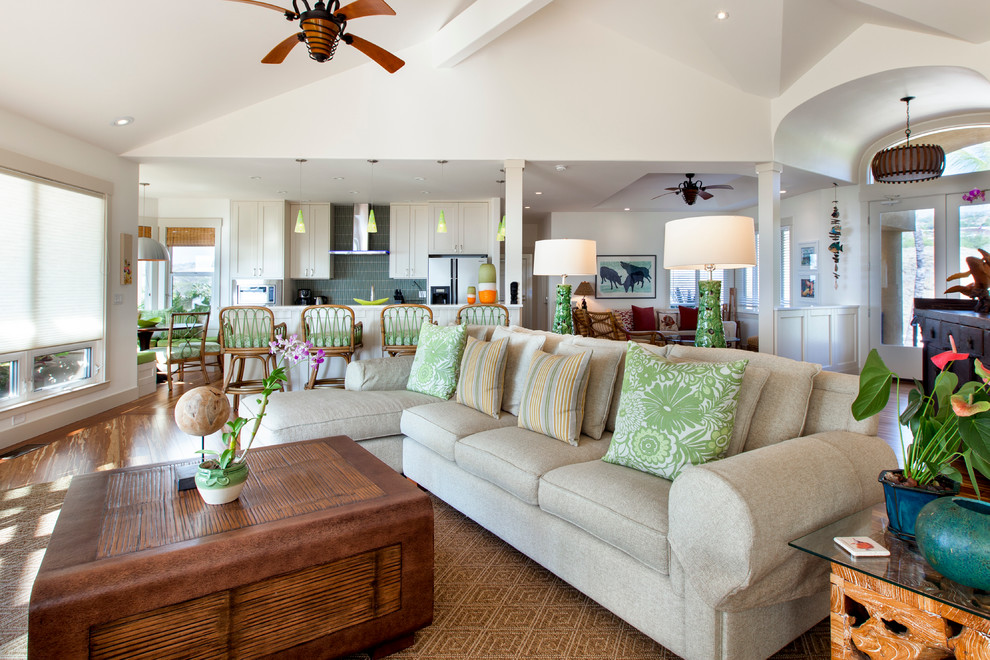 Example of a large island style open concept bamboo floor living room design in Hawaii with white walls