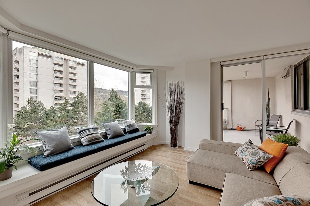 Inspiration for a modern living room remodel in Vancouver with white walls