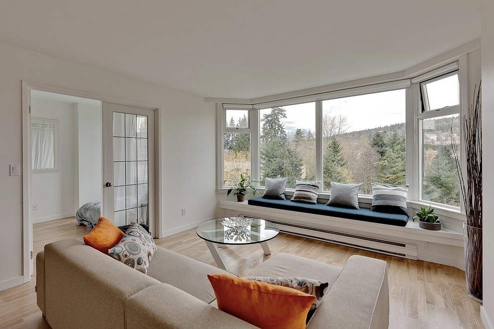 Inspiration for a modern living room remodel in Vancouver with white walls