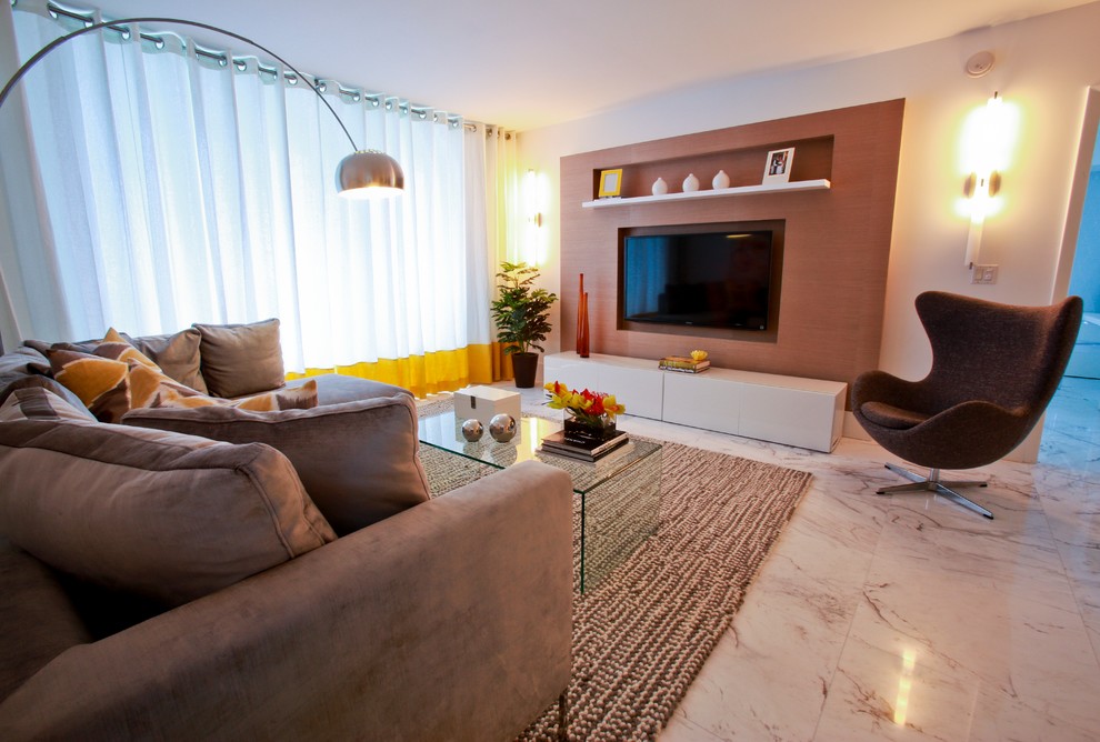 Example of a large trendy open concept marble floor and white floor living room design in Miami with white walls, no fireplace and a wall-mounted tv