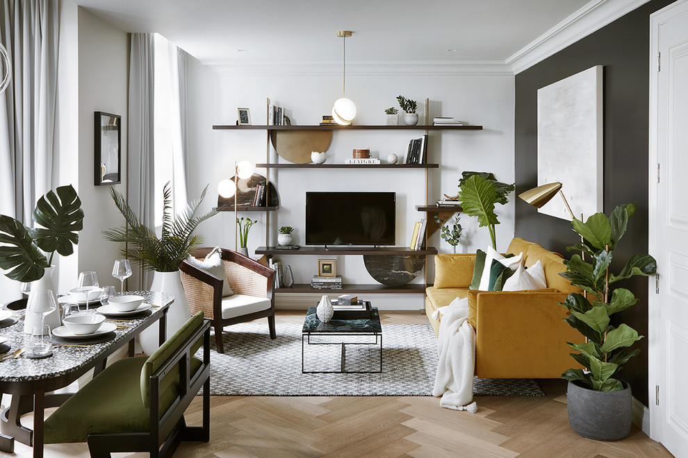 Example of a mid-sized trendy formal and open concept light wood floor and beige floor living room design in London with black walls, no fireplace and a tv stand