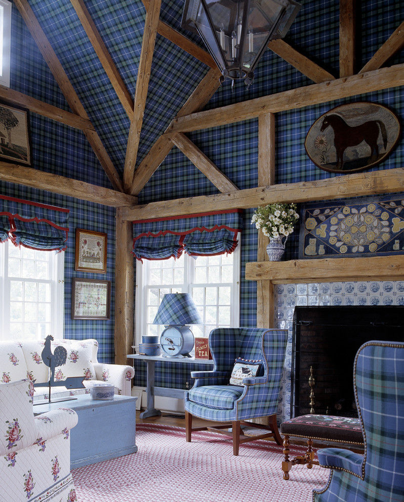 На фото: гостиная комната в стиле фьюжн с синими стенами, стандартным камином и фасадом камина из плитки с