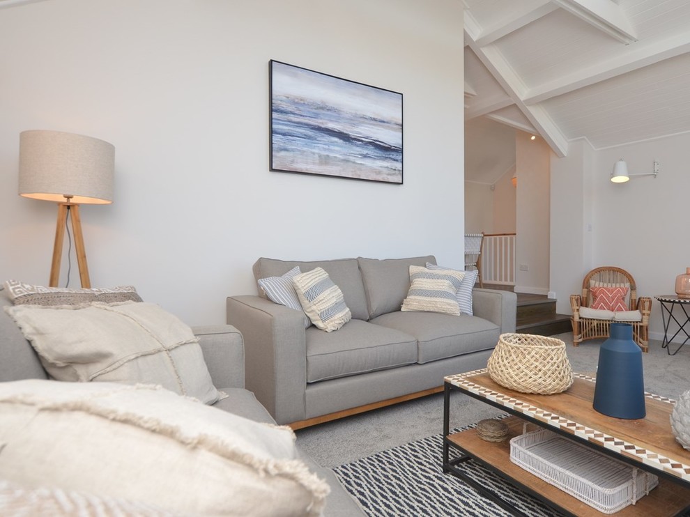 Photo of a medium sized coastal open plan living room in Devon with grey walls, carpet, a freestanding tv and grey floors.