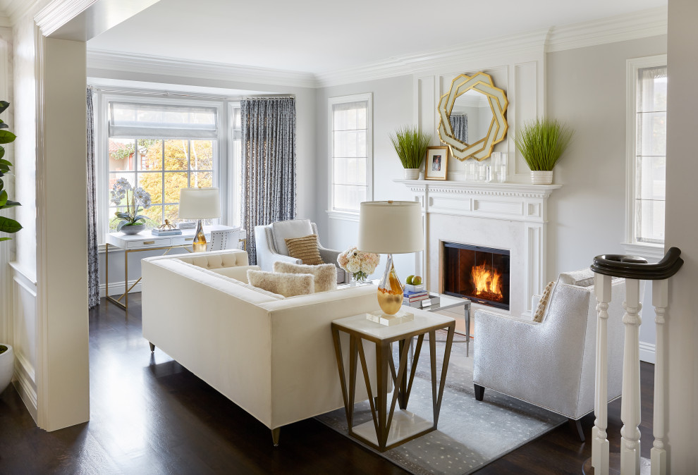 Elegant formal and enclosed dark wood floor and brown floor living room photo in Los Angeles with gray walls, a standard fireplace and no tv