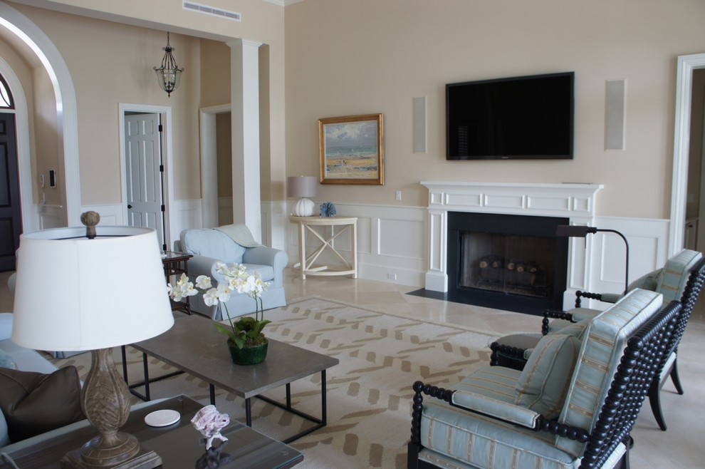 Example of a mid-sized classic formal and enclosed porcelain tile living room design in Toronto with beige walls, a standard fireplace, a plaster fireplace and a wall-mounted tv