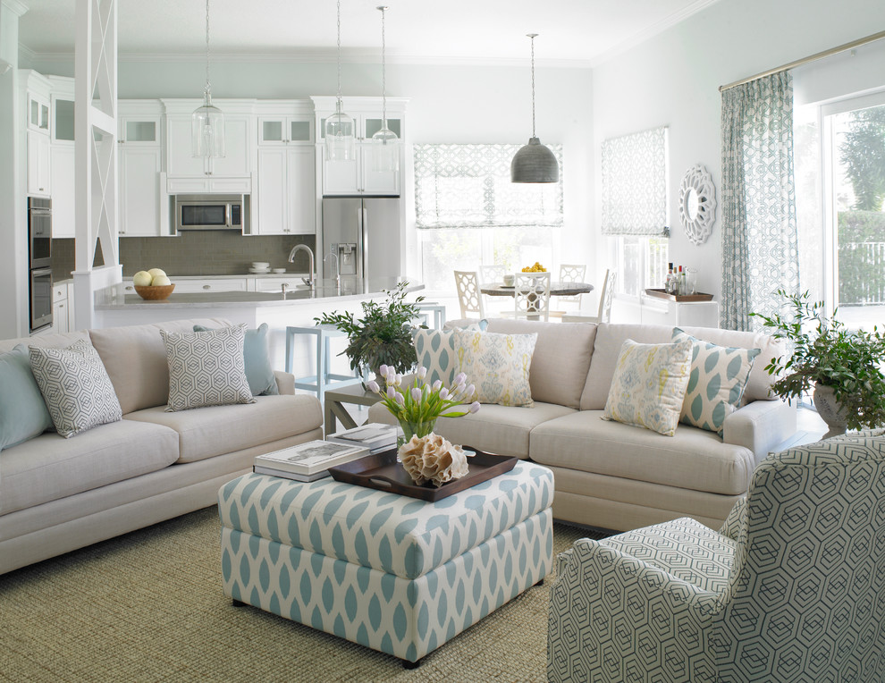Photo of a coastal open plan living room in Miami with white walls.
