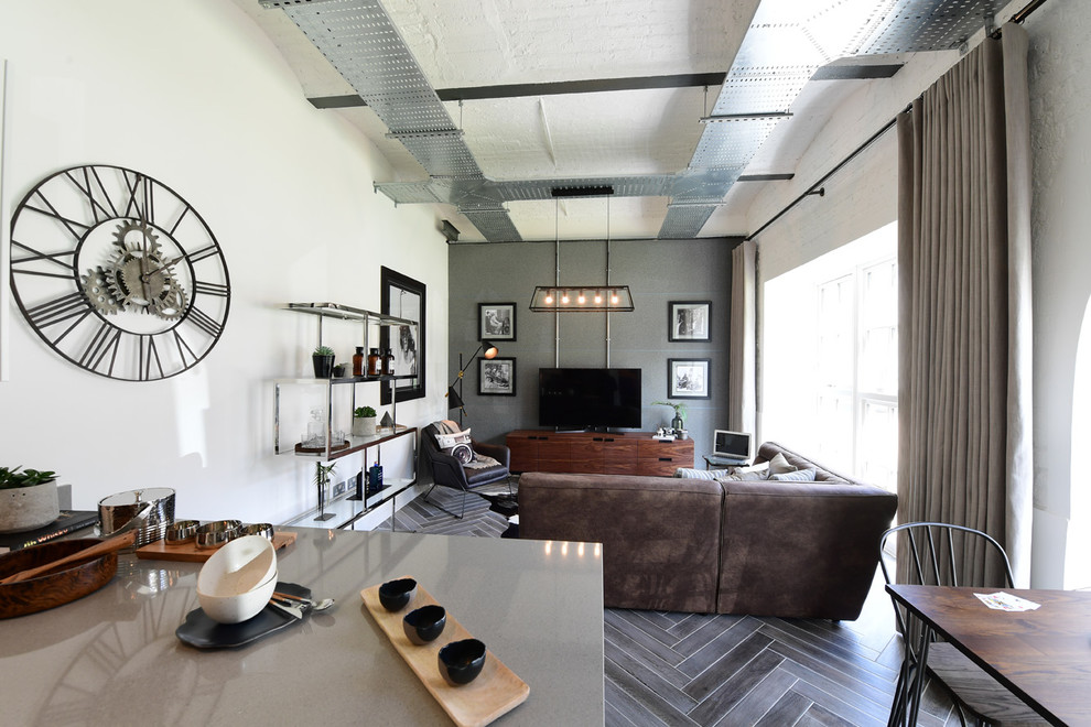 This is an example of a contemporary living room in London with porcelain flooring and grey floors.