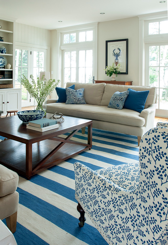 Example of a beach style living room design in Portland Maine