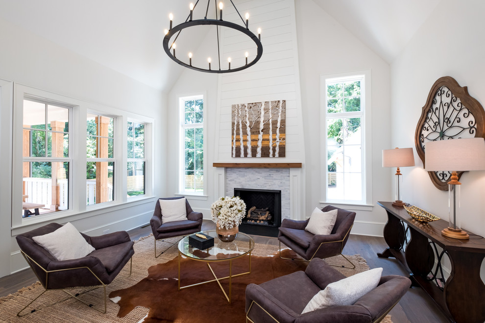 Photo of a farmhouse formal enclosed living room in Charlotte with white walls, dark hardwood flooring, a standard fireplace and brown floors.