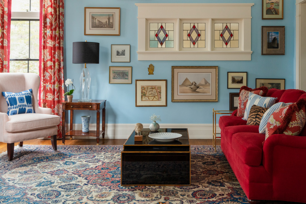 Example of a large arts and crafts open concept dark wood floor and brown floor living room design in Boston with blue walls, a standard fireplace and a tile fireplace