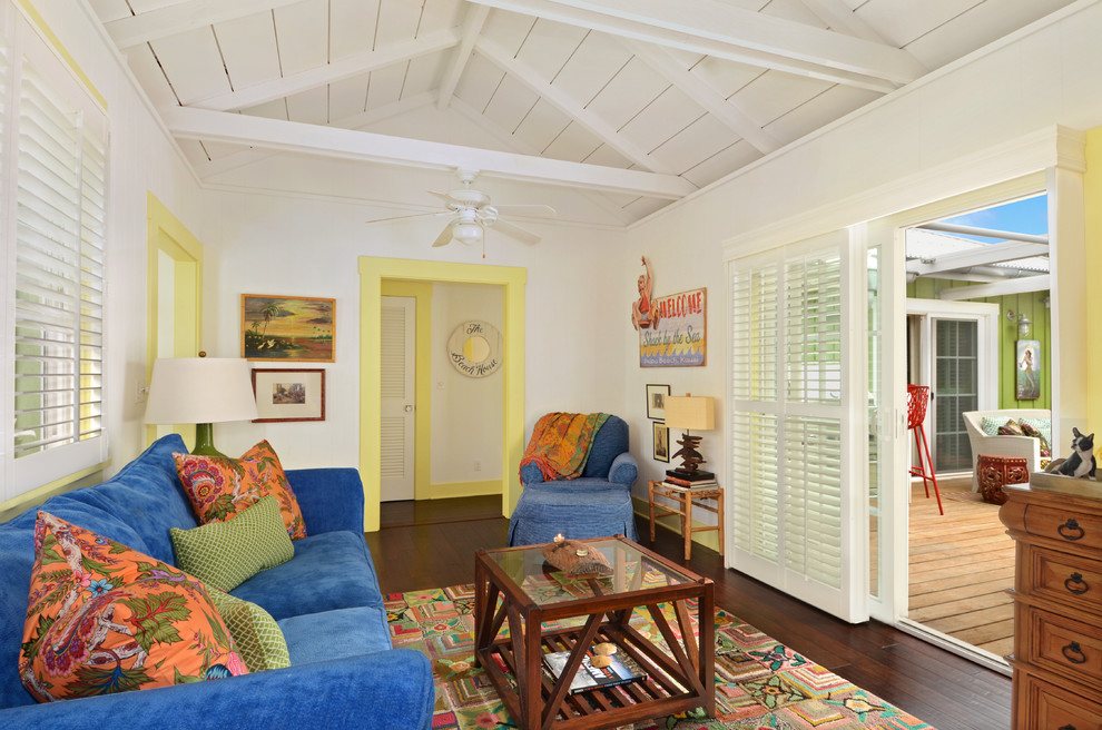 Island style formal and enclosed dark wood floor living room photo in Hawaii with white walls
