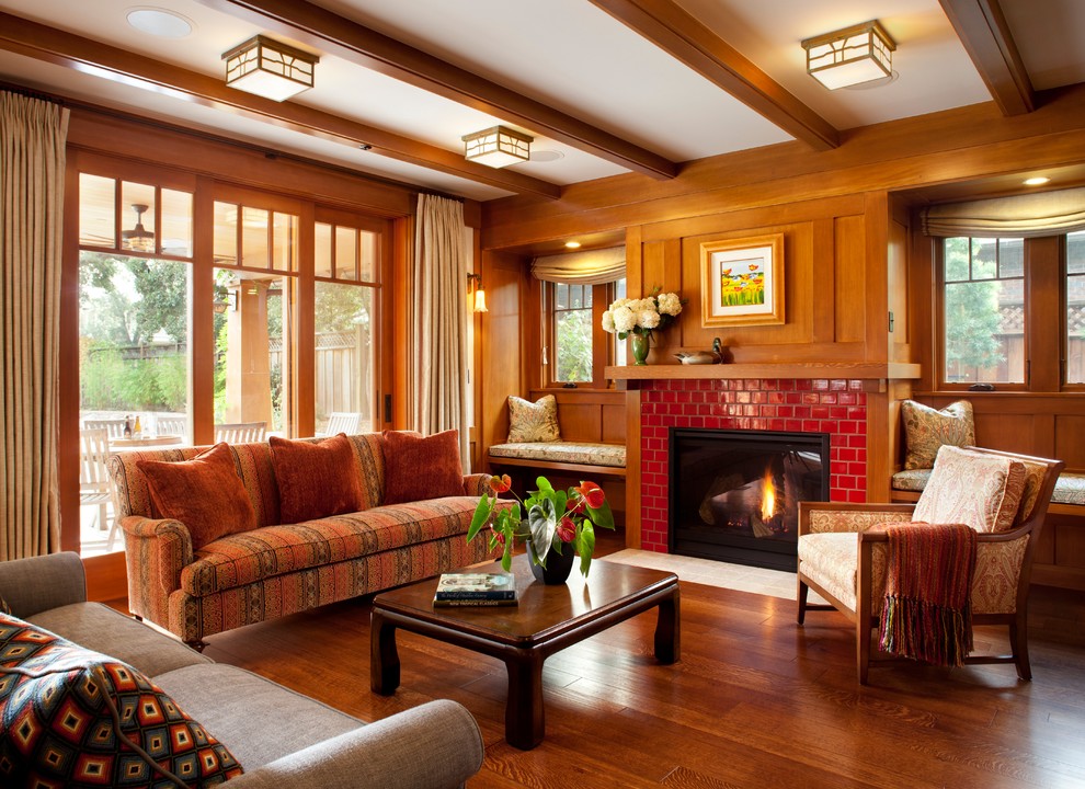 Design ideas for a traditional formal enclosed living room in San Francisco with medium hardwood flooring, a standard fireplace, a tiled fireplace surround and no tv.