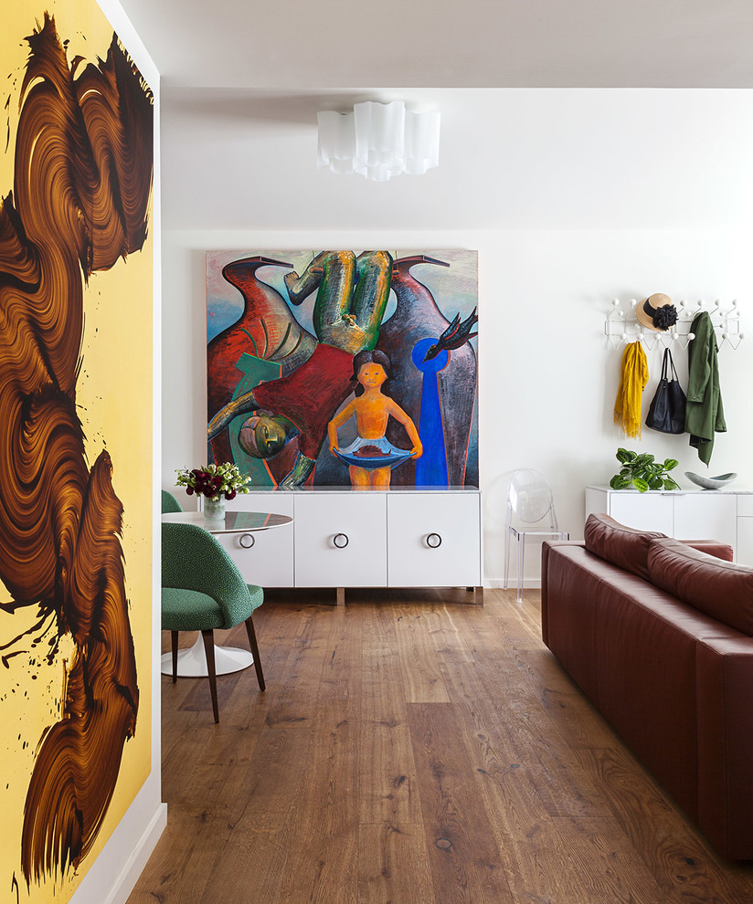 Eclectic open concept dark wood floor and brown floor living room photo in San Francisco with white walls