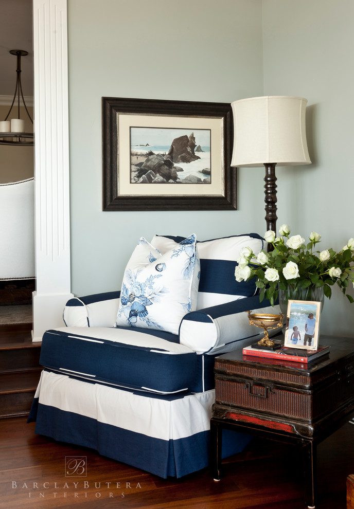 This is an example of a nautical living room in Los Angeles with blue walls and medium hardwood flooring.