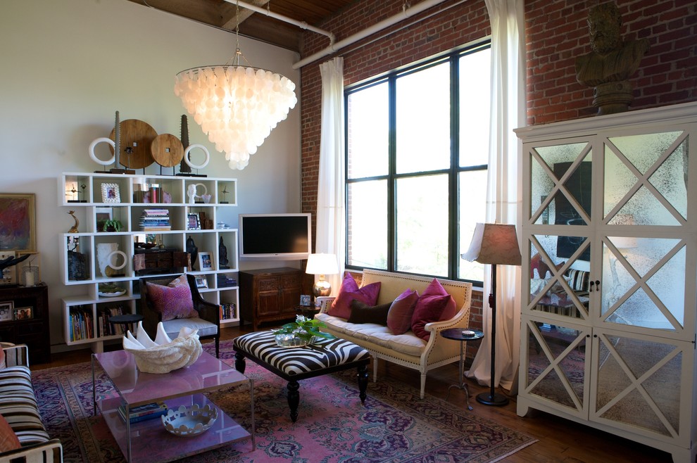 Trendy living room library photo in Raleigh with a wall-mounted tv