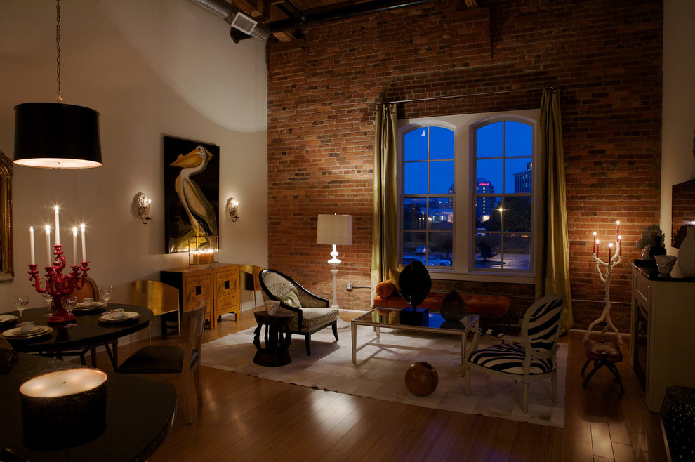 Inspiration for a large industrial medium tone wood floor living room remodel in Raleigh