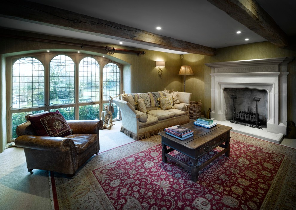 This is an example of a medium sized classic formal enclosed living room in Other with yellow walls, slate flooring, a standard fireplace, a stone fireplace surround and no tv.