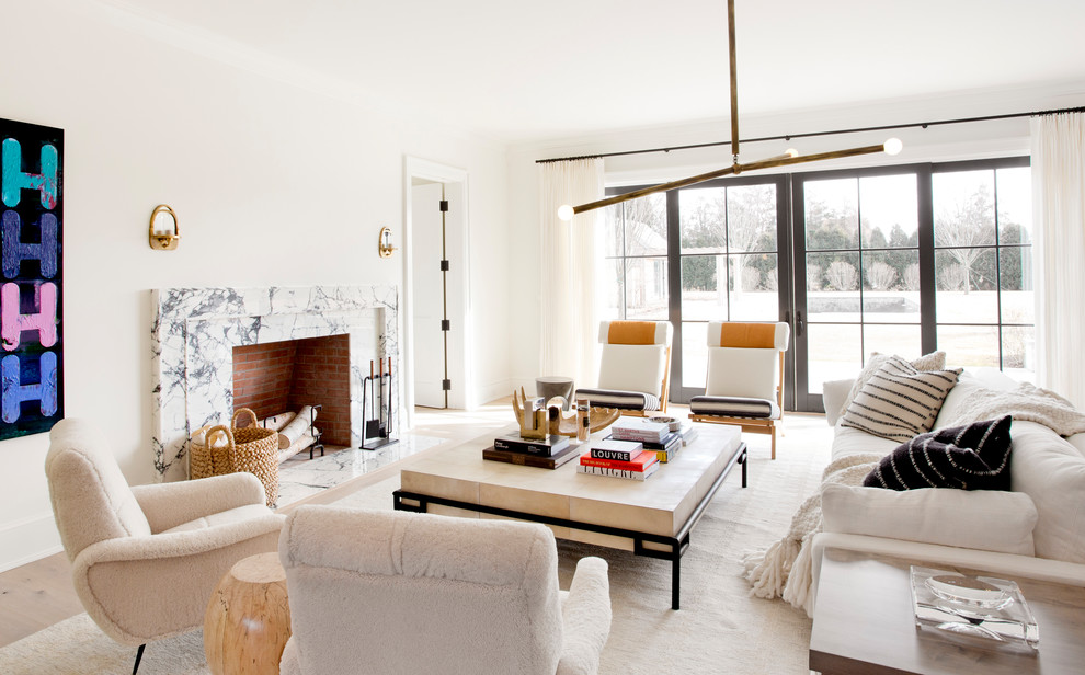 Large danish formal and enclosed light wood floor and beige floor living room photo in New York with white walls, a standard fireplace, a stone fireplace and no tv
