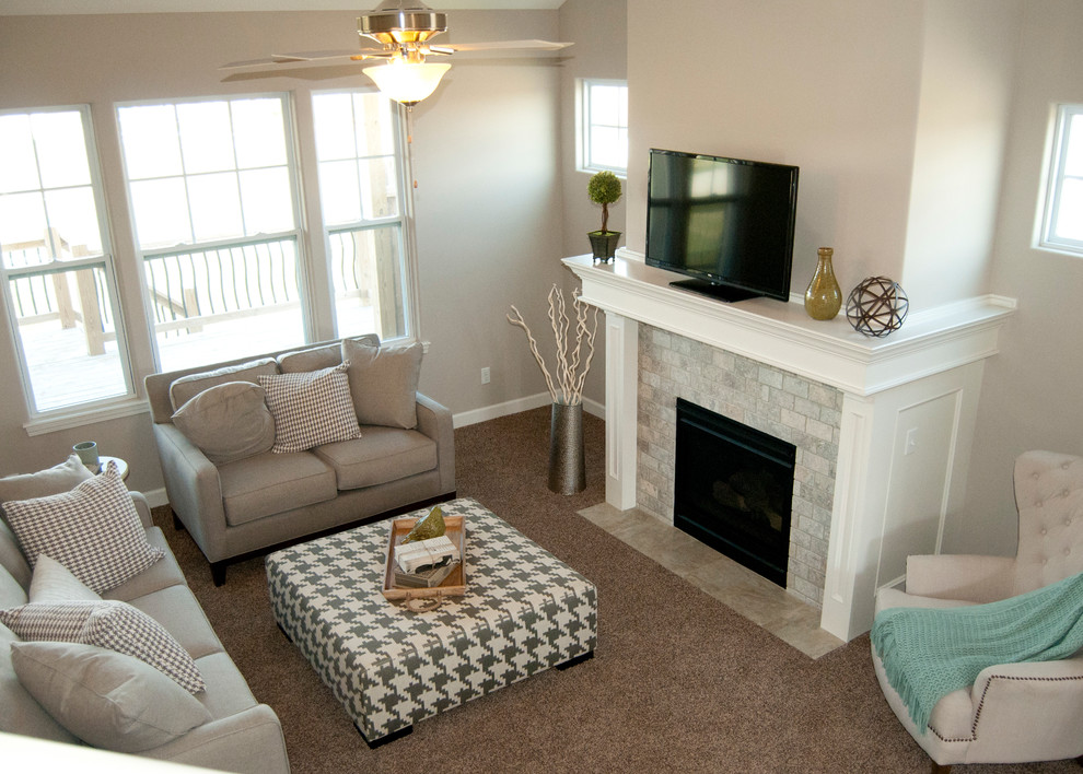 Mid-sized arts and crafts open concept carpeted living room photo in Kansas City with gray walls, a standard fireplace, a stone fireplace and a media wall