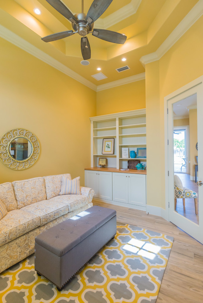 Medium sized classic enclosed living room in Miami with yellow walls, no fireplace and no tv.