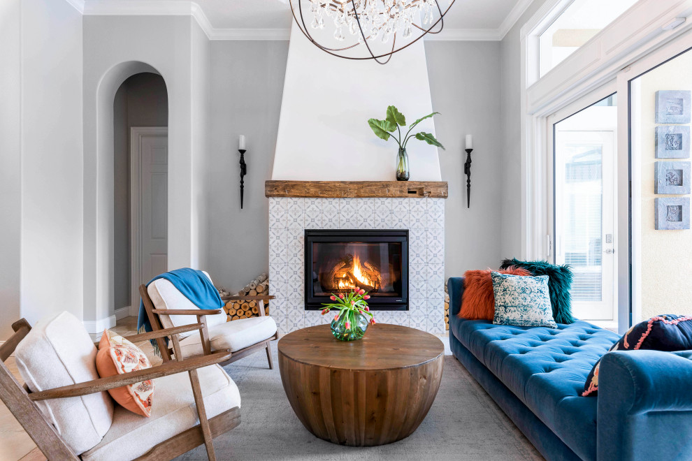 Inspiration for a coastal open concept living room remodel in Orlando with gray walls, a standard fireplace and a tile fireplace