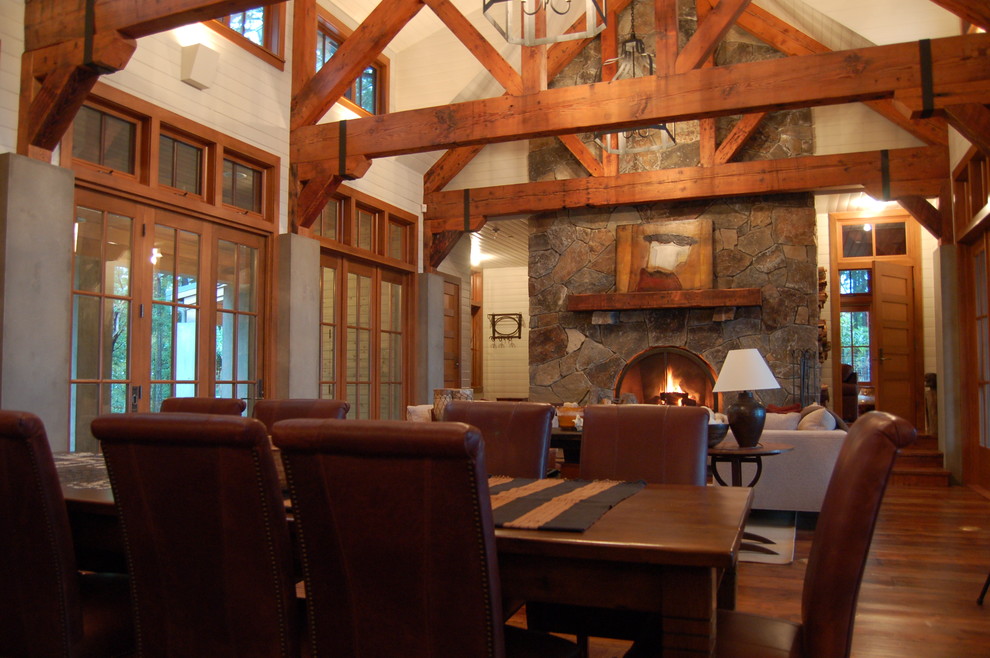 Inspiration for a rustic living room in Seattle with a standard fireplace and a stone fireplace surround.