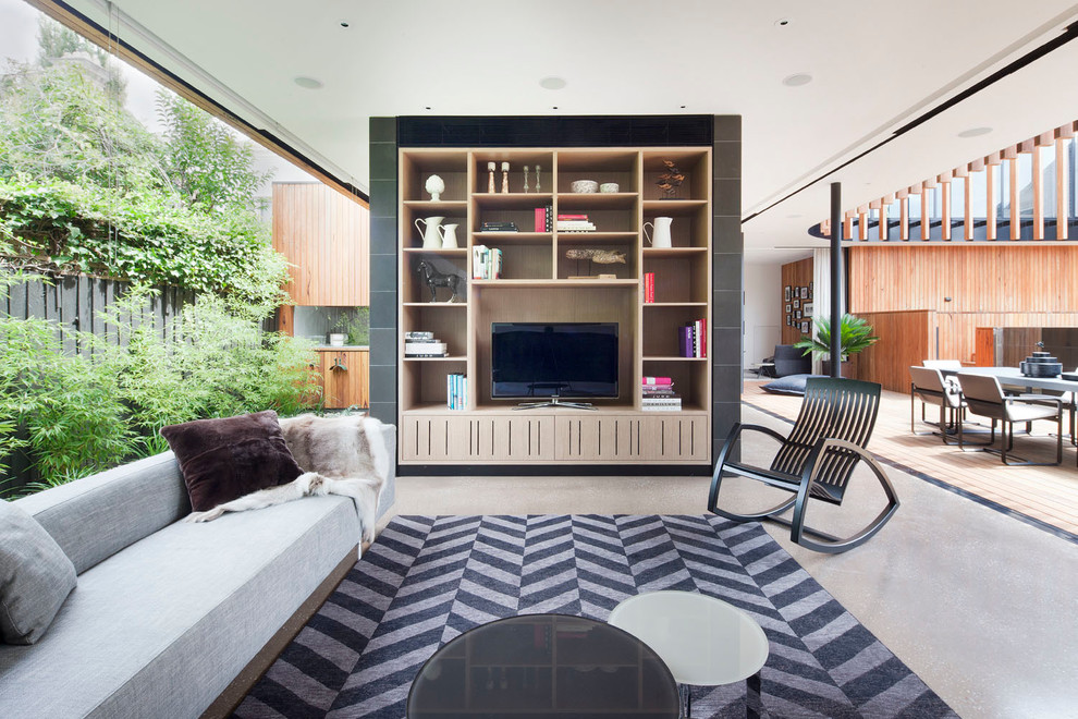 Источник вдохновения для домашнего уюта: большая гостиная комната в современном стиле с бетонным полом