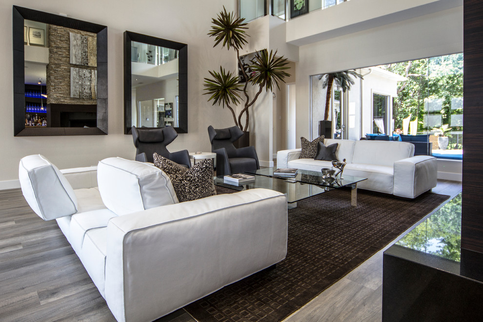 Photo of a large contemporary formal open plan living room in Dallas with beige walls, dark hardwood flooring, no fireplace and a wall mounted tv.