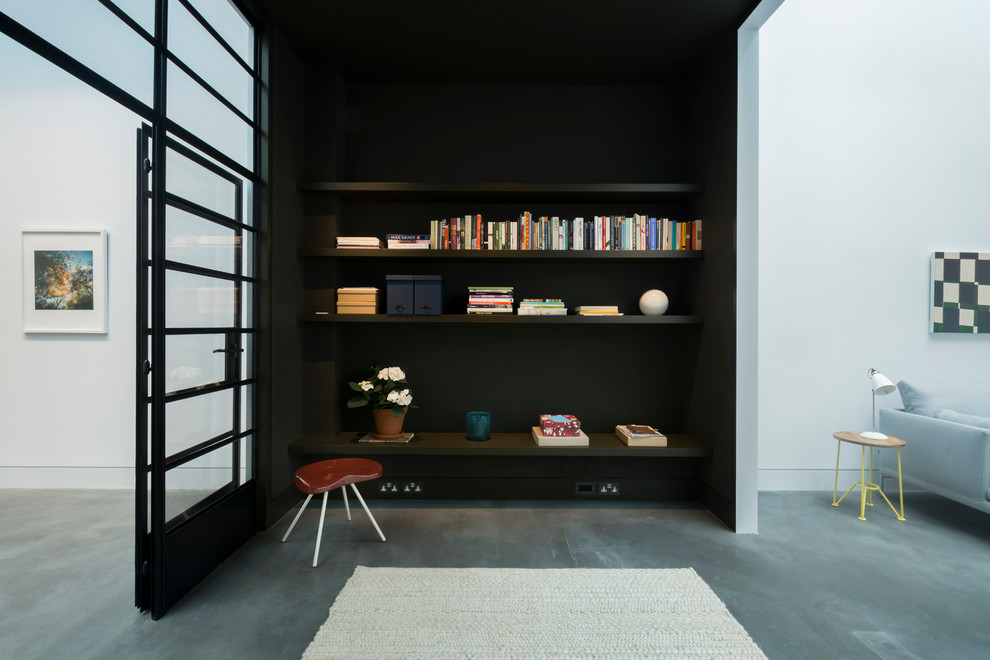 Design ideas for an expansive urban formal open plan living room in London with black walls and concrete flooring.