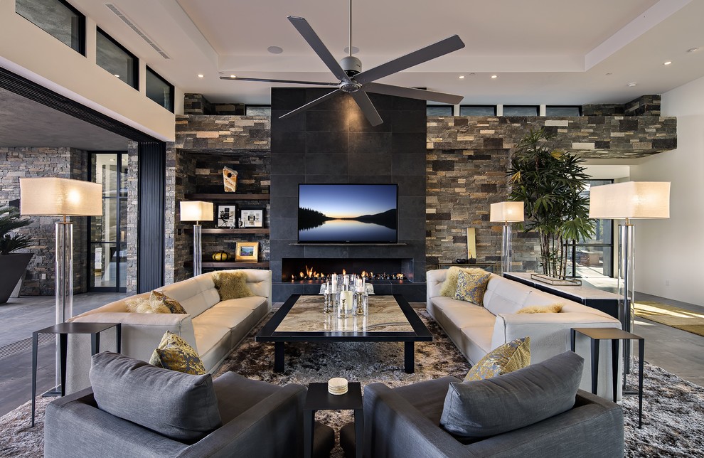 Living room - large contemporary open concept porcelain tile living room idea in Phoenix with a ribbon fireplace, a stone fireplace, a wall-mounted tv and white walls