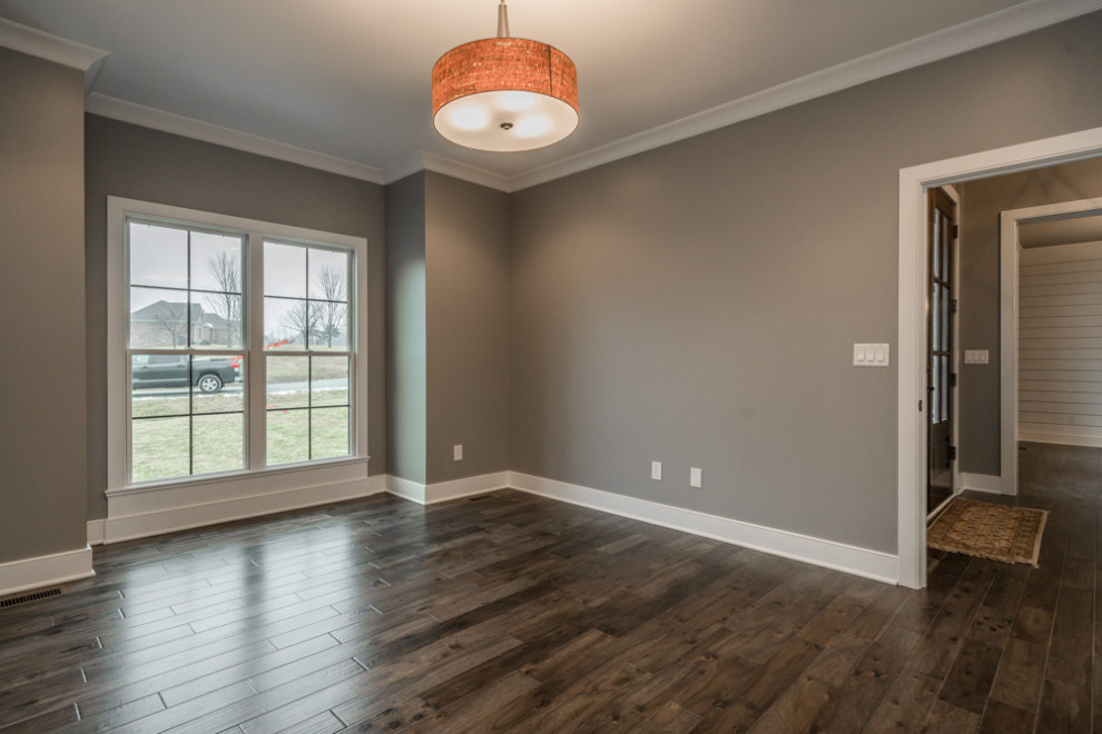 Example of a transitional formal and enclosed dark wood floor and brown floor living room design in Louisville with gray walls