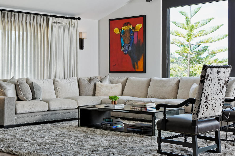 Trendy dark wood floor living room photo in Los Angeles with white walls