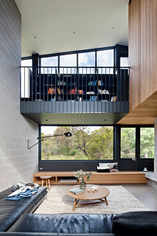 Offenes Industrial Wohnzimmer mit grauer Wandfarbe und grauem Boden in Geelong